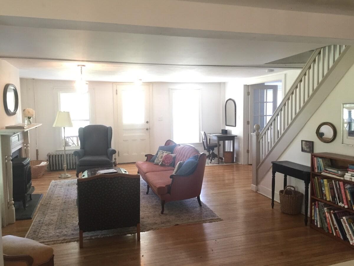 Front door leads into living room with propane fireplace.